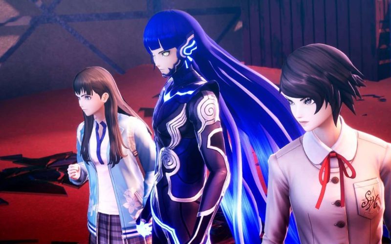 The protagonist and two side characters stand beside each other in Shin Megami Tensei V Vengeance.